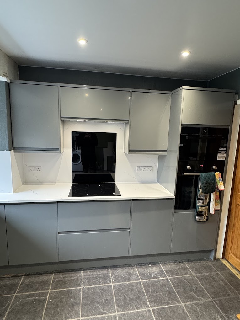Bespoke grey handleless kitchen with marble worktops